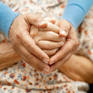caregiver-holding-hands-asian-elderly-woman-patient-with-love-care-encourage-and-empathy-at-nursing-hospital-healthy-strong-medical-concept-photo